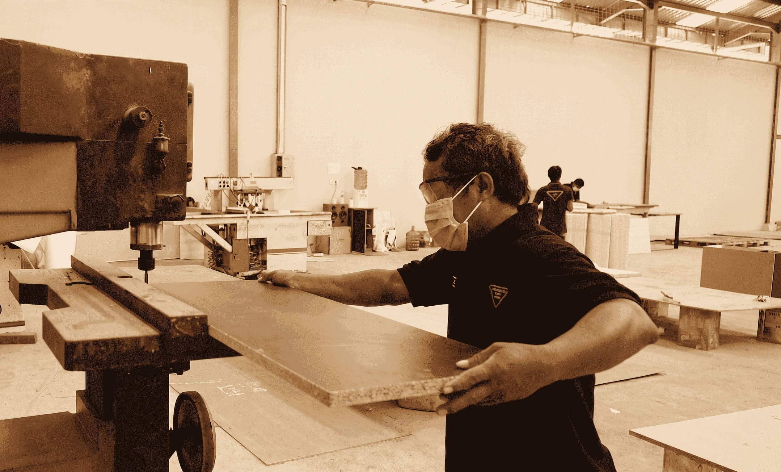 Intermulti craftsman at bandsaw — Jakarta workshop